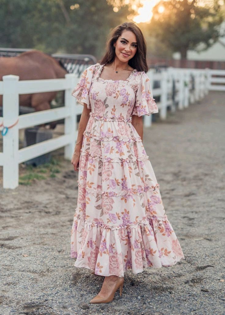 pink floral smocked maxi dress with flutter sleeves, ideal for a romantic tea party